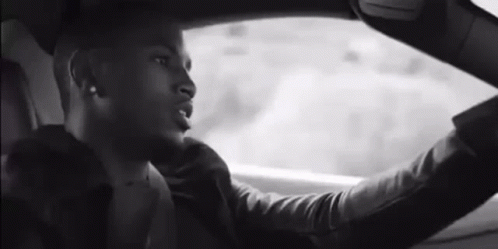 Man Driving Car Looking Out Window GIF