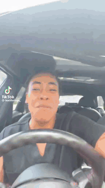 Man Driving Car Making Face