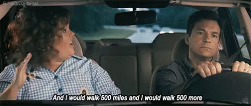 Man Driving Car Next to Woman
