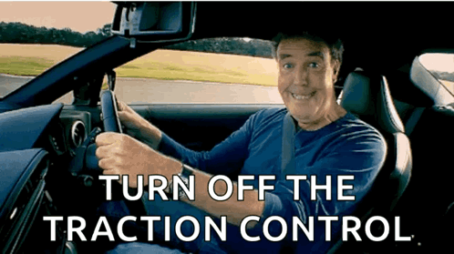 Man Driving Car Turn Off the Traction Control