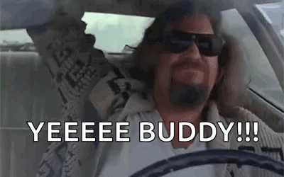 Man Driving Car with Arms Up and Sunglasses