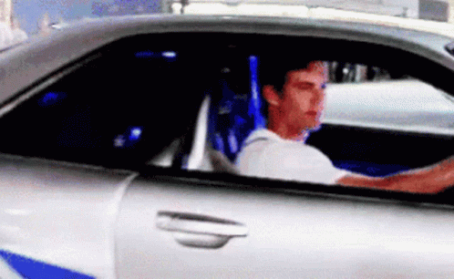 Man Driving Car With Blue Seat