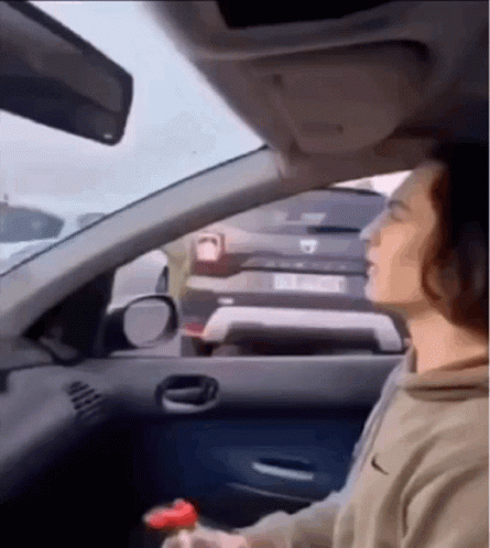 Man Driving Car With Eyes Closed And Bottle GIF