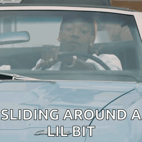 Man Driving Car With Sliding Around A Lil Bit