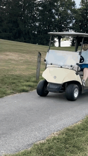 Man Driving Golf Cart On Road GIF