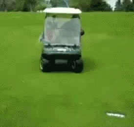 Man Driving Golf Cart With Woman On Back GIF