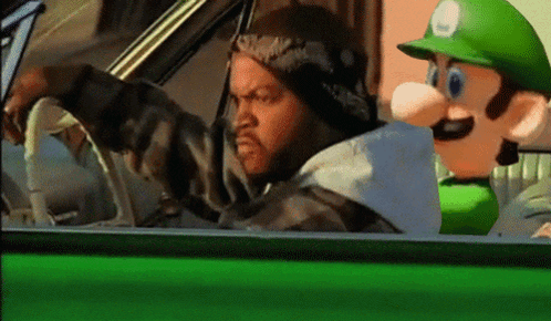 Man Driving Green Car With Mario Mascot GIF