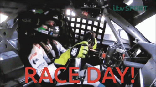 Man Driving Race Car With Race Day
