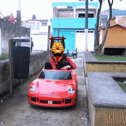 Man Driving Red Toy Car With Duck Face