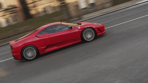Man Driving Red Toy Car With Duck Face