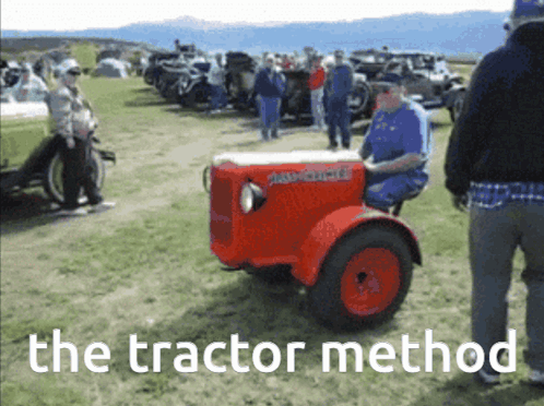 Man Driving Red Tractor The Tractor Method