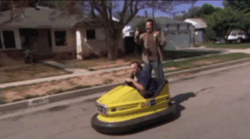 Man Driving Yellow Bumper Car Number 01 GIF