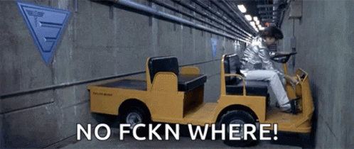 Man Driving Yellow Vehicle In Tunnel GIF