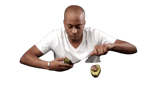 Man Eating Avocado with Knife and Fork