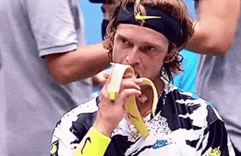 Man Eating Banana With Nike Headband