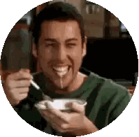 Man Eating Bowl of Food With Spoon Smiling
