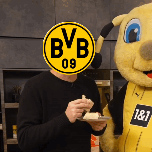 Man Eating Cake With BVB 09 Logo on Head