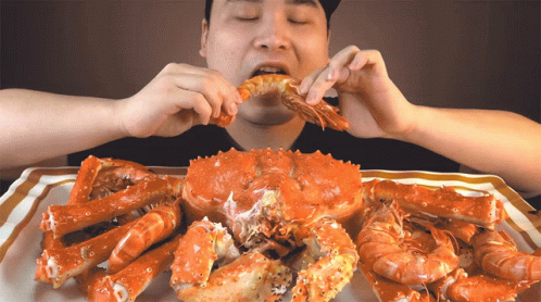 Man Eating Crab And Shrimp GIF