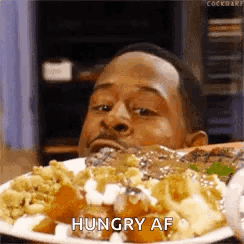 Man Eating Food Saying Hungry