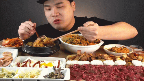 Man Eating Food with Chopsticks