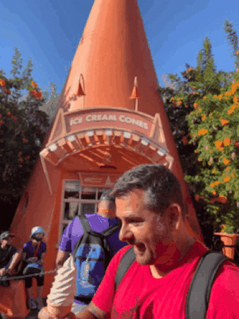 Man Eating Ice Cream In Disneyland GIF