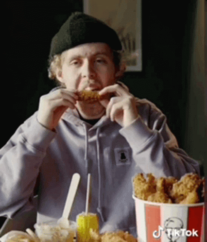 Man Eating KFC Fried Chicken From Bucket GIF