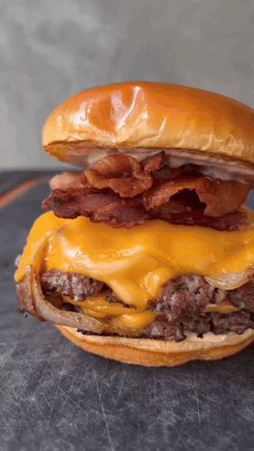 Man Eating Large Hamburger