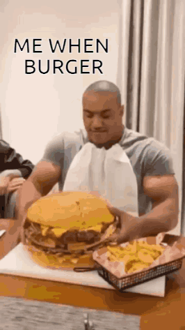 Man Eating Large Hamburger