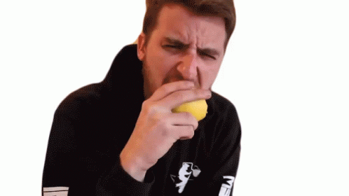 Man Eating Lemon With Sour Face GIF