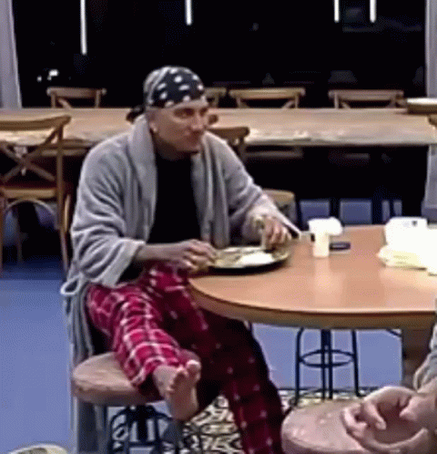 Man Eating Meal at Table