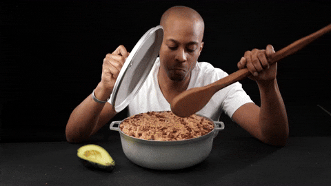 Man Eating Rice On Pan Using Big Spoon GIF