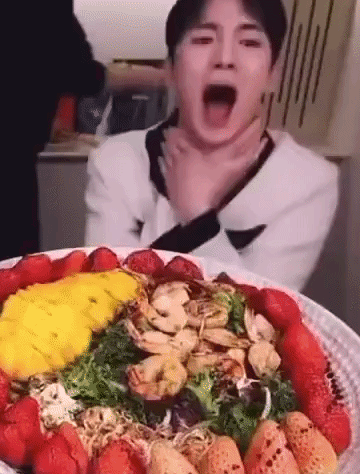 Man Eating Salad With Strawberries And Shrimp GIF