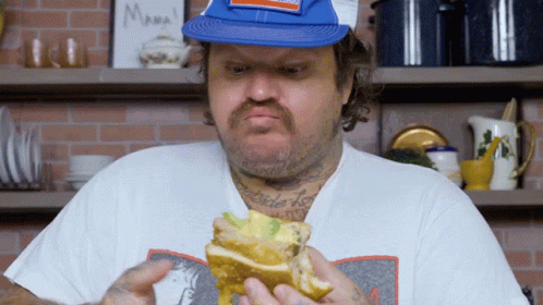 Man Eating Sandwich in Front of Mama Sign