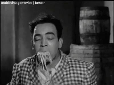 Man Eating Spaghetti in Black and White