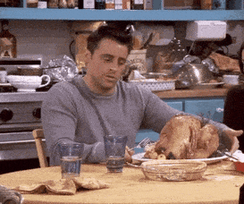 Man Eating Turkey at Table