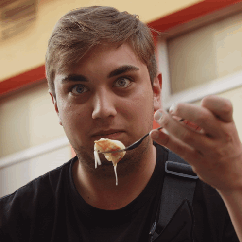 Man Eating with Spoon