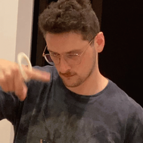Man Enjoying Spinner In His Finger GIF