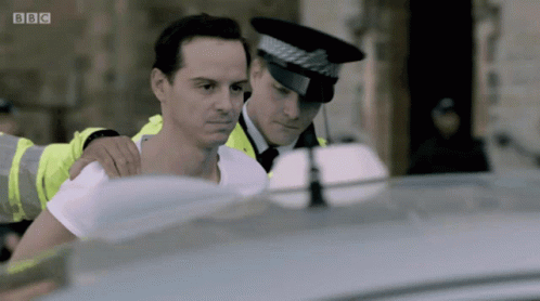 Man Escorted By Police Officer With BBC Logo GIF