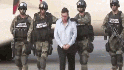 Man Escorted by Soldiers with Exercito Mexicano