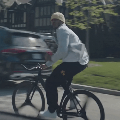 Man Fast Biking In Urban GIF