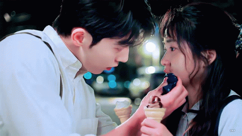Man Feeding Woman Ice Cream Cone GIF