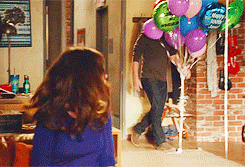 Man Fighting Balloons GIF