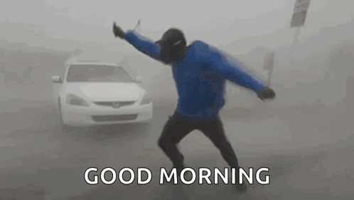 Man Fighting Strong Winds Of Bomb Cyclone GIF