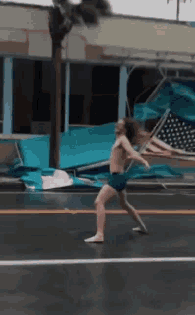Man Fighting Windy Day GIF