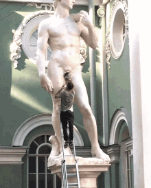 Man Fixing A Sculpture GIF