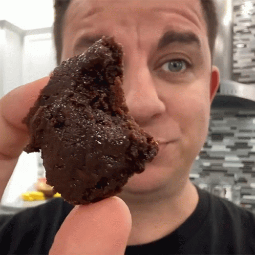 Man Flexing Chocolate Moist Cake GIF