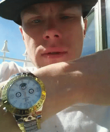 Man Flexing Gold Watch GIF