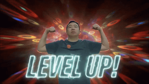 Man Flexing Muscles in Front of Level Up Neon Sign