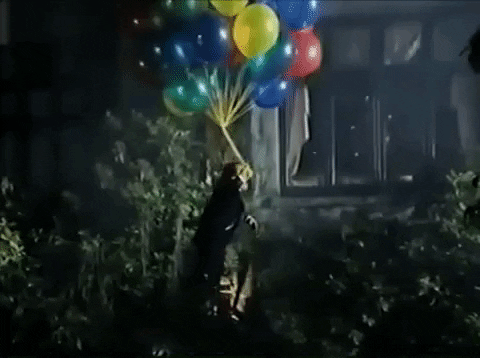 Man Floating With Baloons GIF