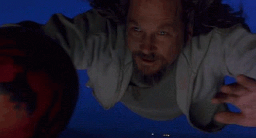 Man Flying Holding Bowling Ball GIF
